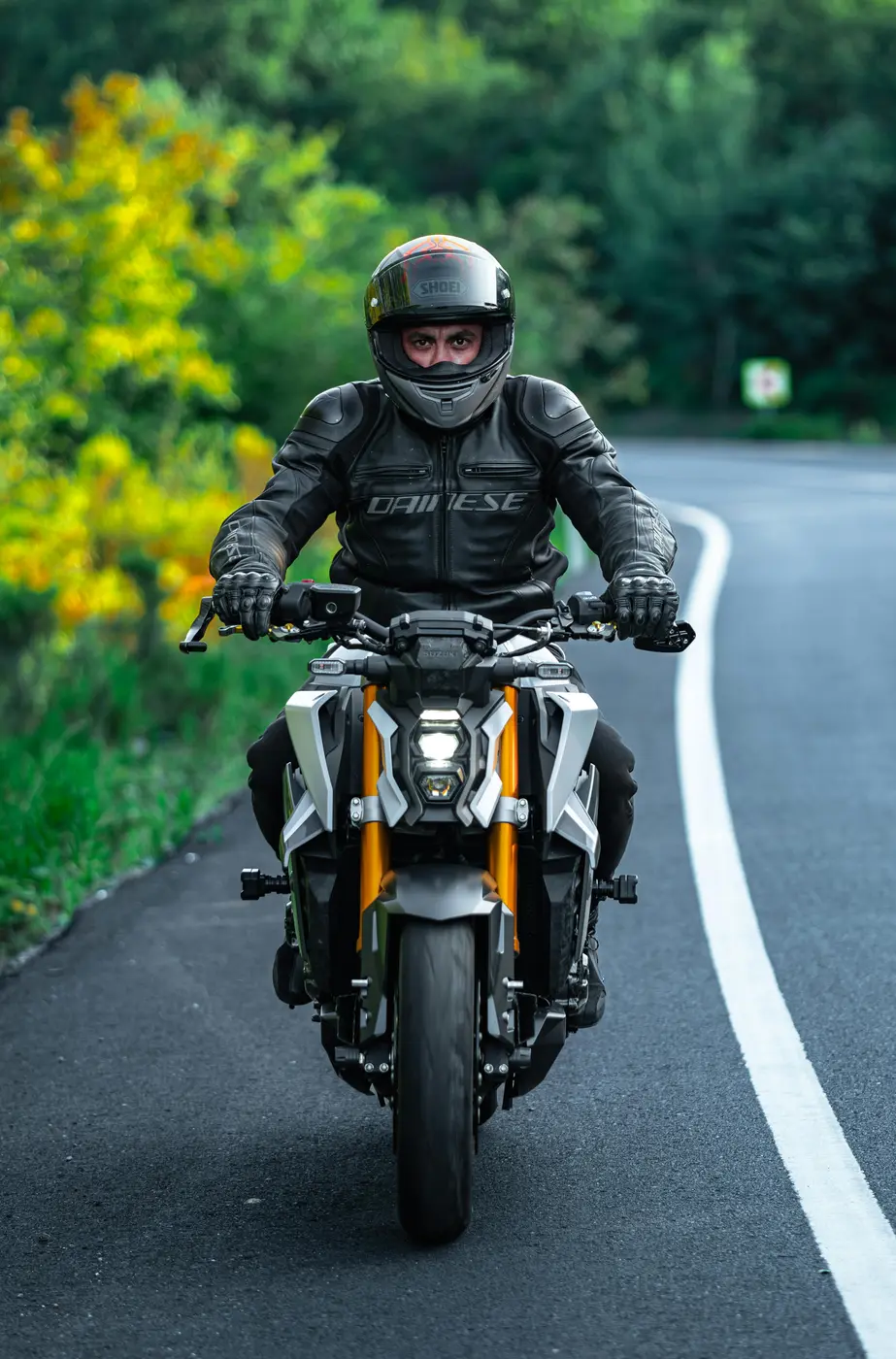 Motorcyclist wearing protective leather clothing