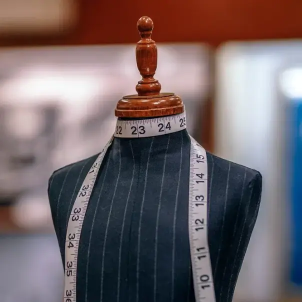 Tailor's mannequin and measuring tape