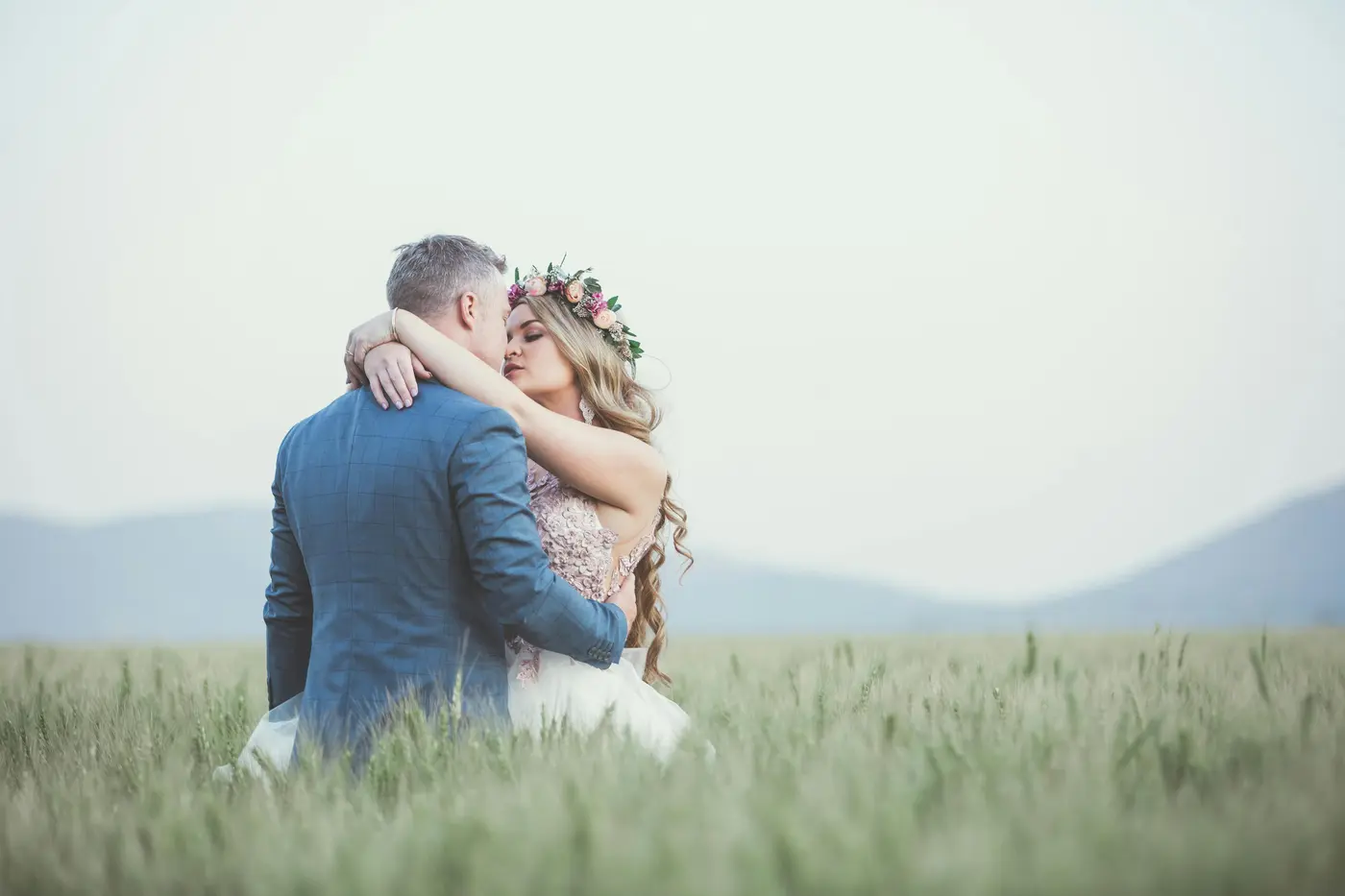 Wedding couple embracing outdoors